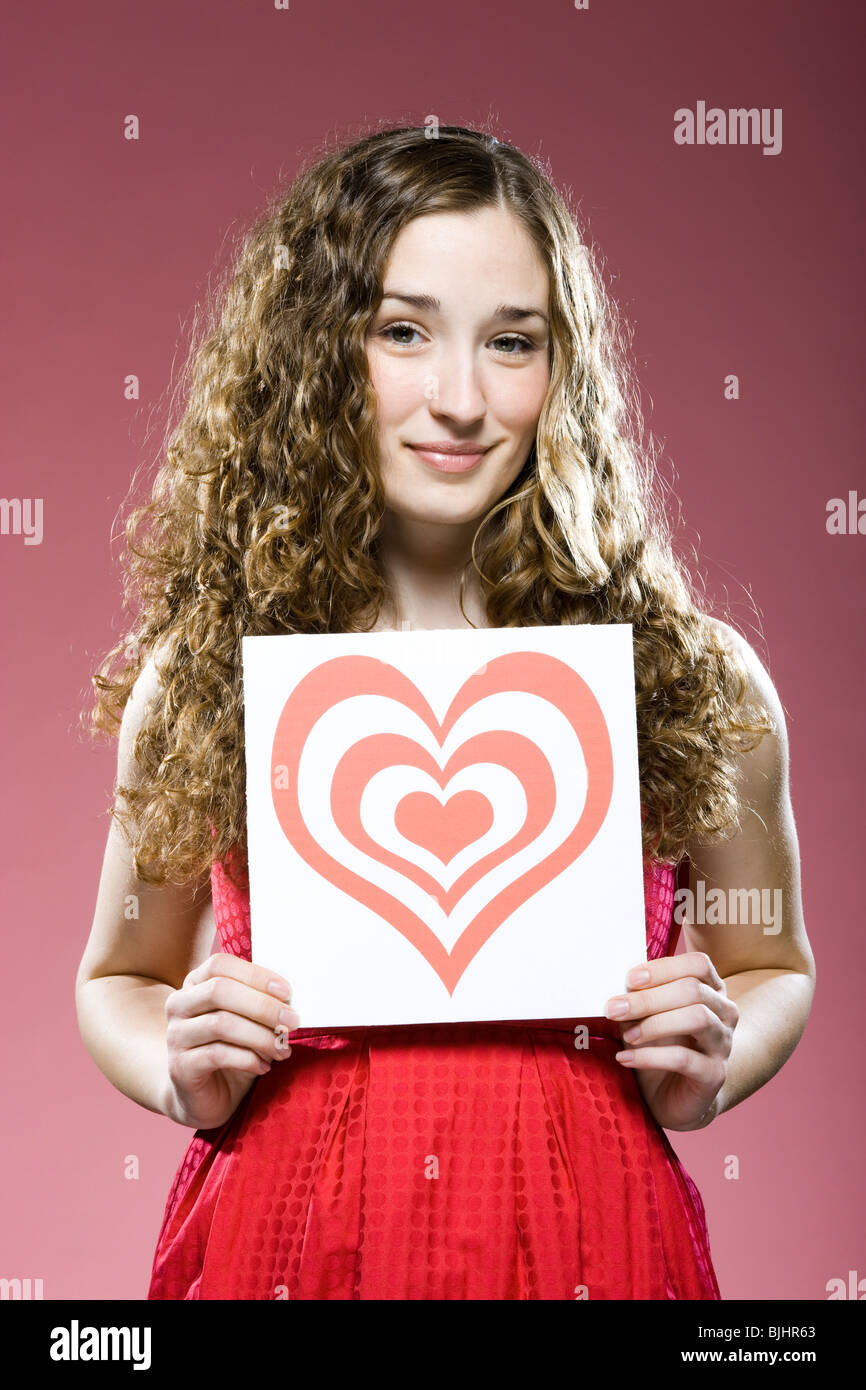 Woman holding chest heart hires stock photography and images Alamy