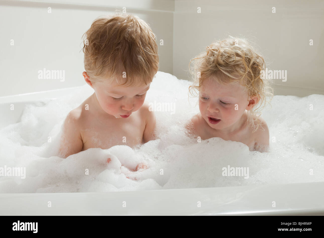 Children playing with bubbles in the bath tub Stock Photo Alamy