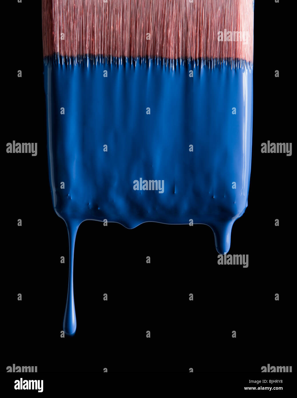 Paint brush and blue paint Stock Photo