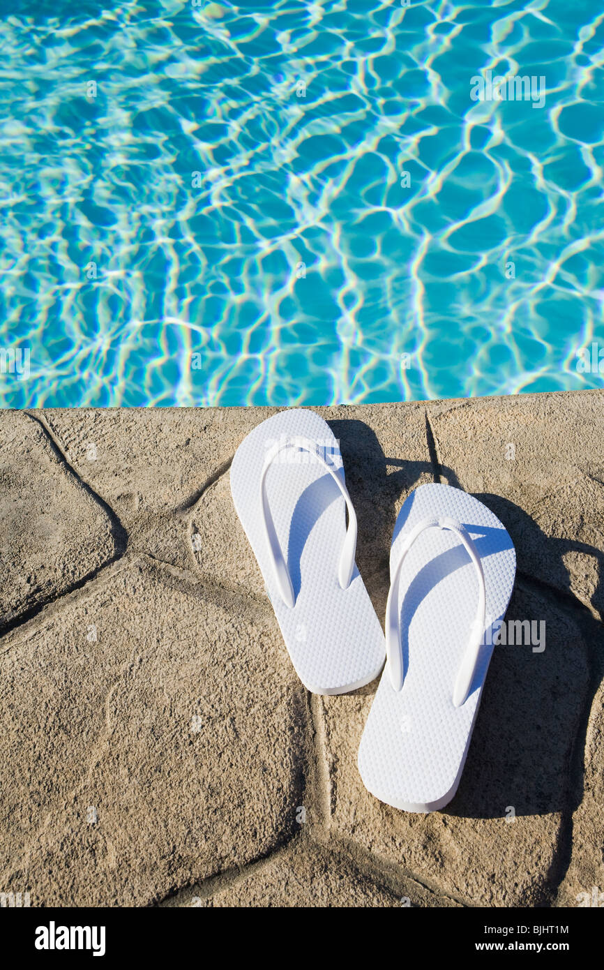 Flip flops by the pool Stock Photo Alamy