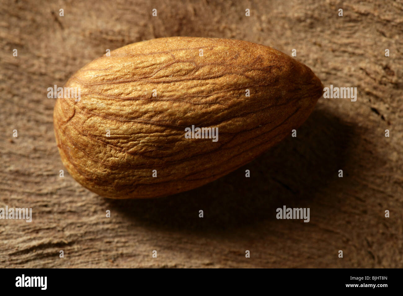 Almond macro over wood background, warm image Stock Photo Alamy