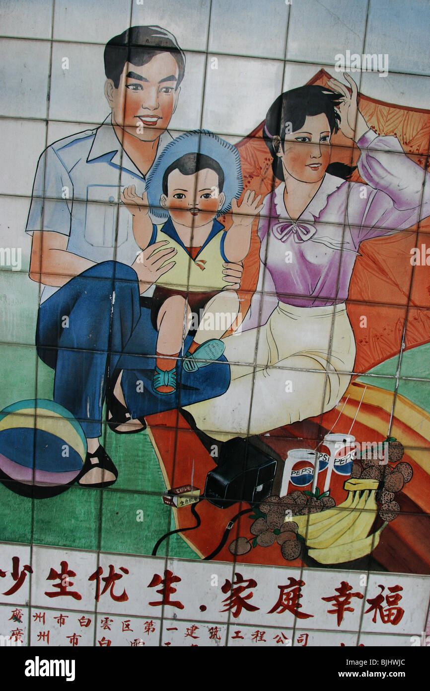 A tiled mural in a Guangzhou street advocates 'happy families', and China's 'one child' policy for families, China. Stock Photo