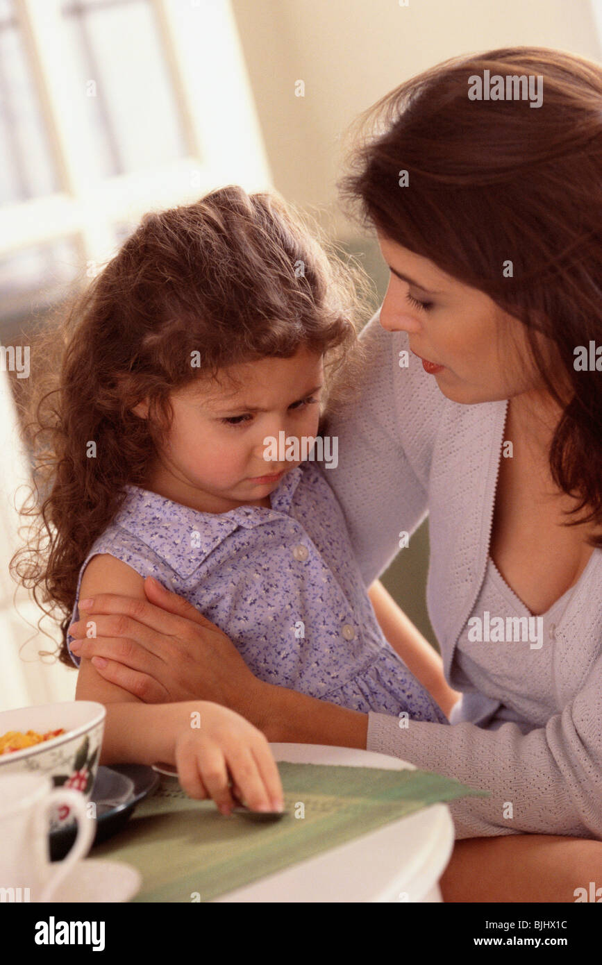 Mother talking to daughter Stock Photo