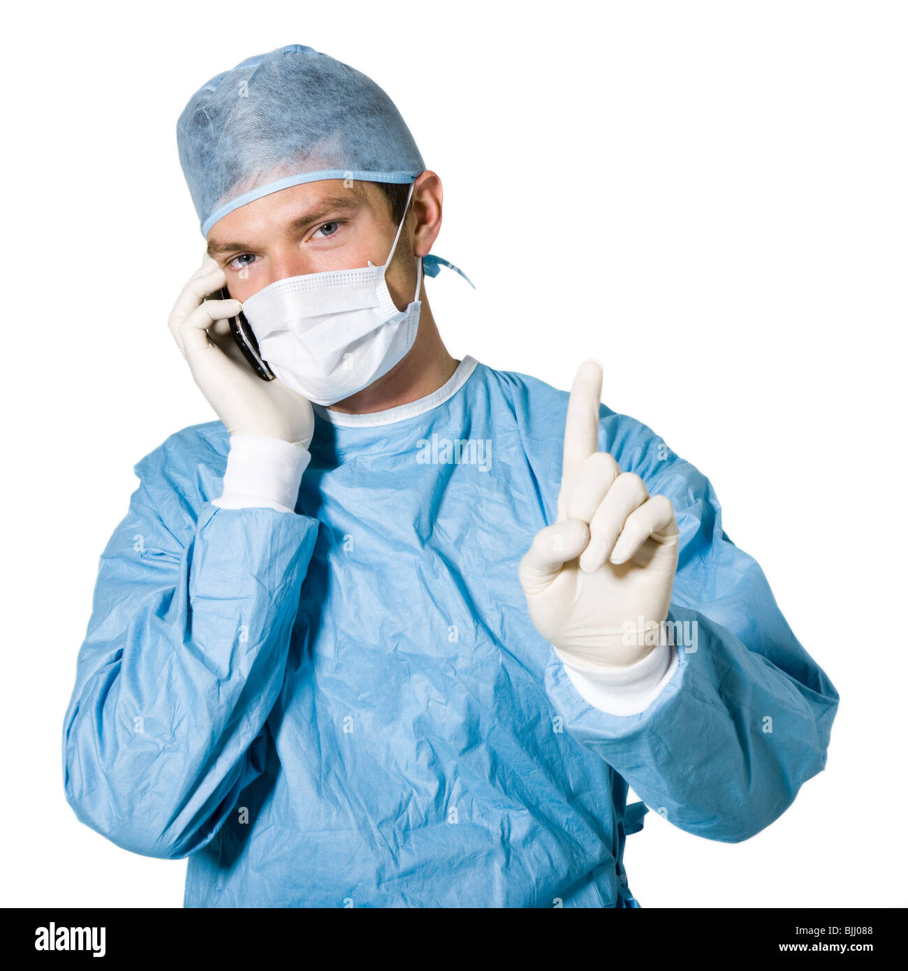 doctor on his cell phone in the middle of a procedure Stock Photo
