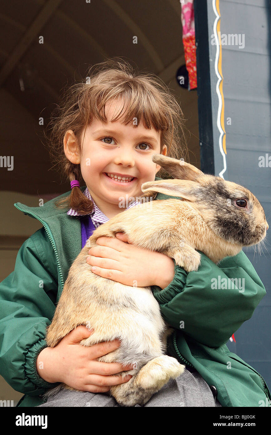 girl holding rabbit in Gypsy Caravan Stock Photo Alamy