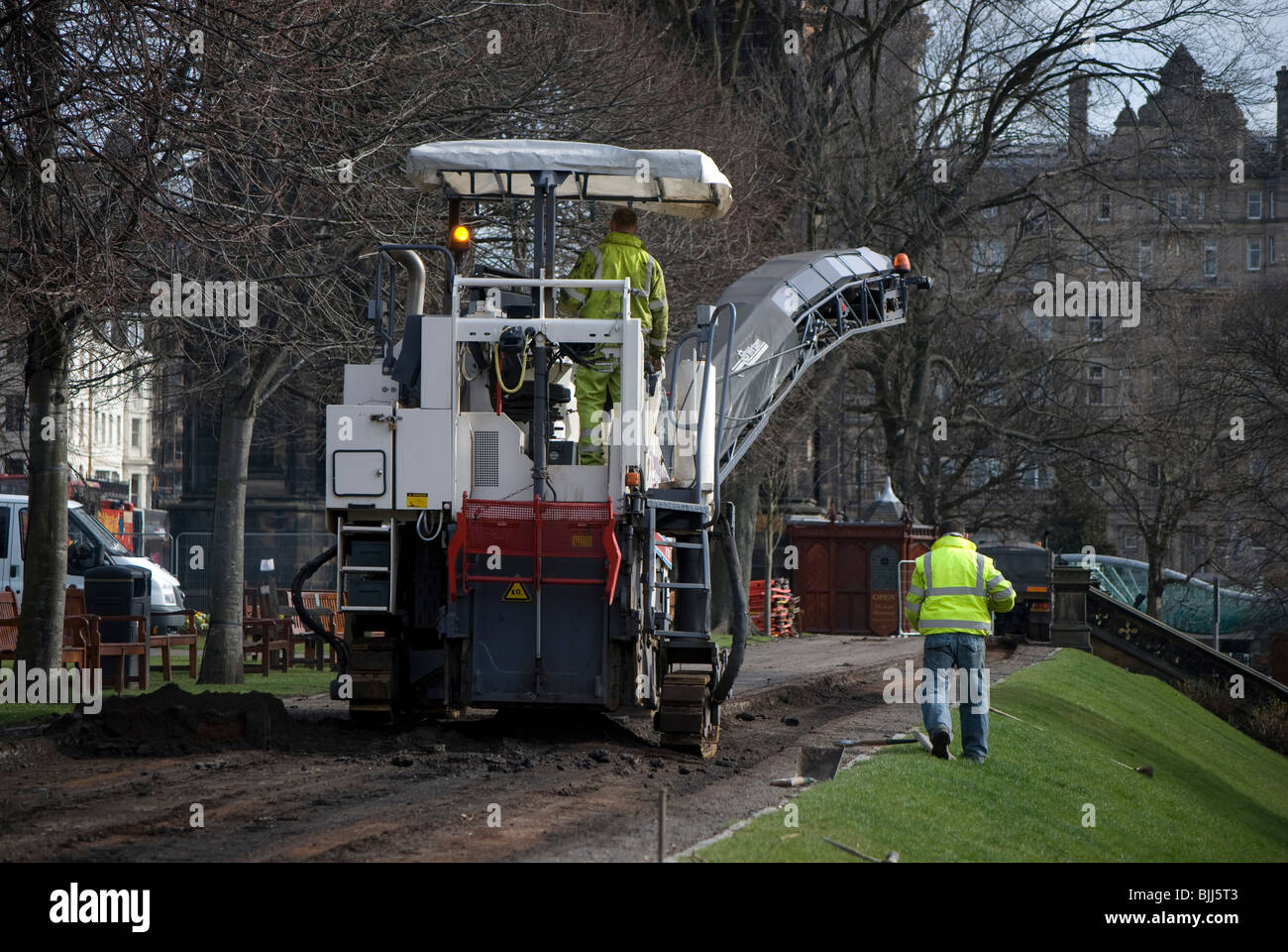 Scarifier digging up a path in Princes Street Gardens, Edinburgh. Stock Photo