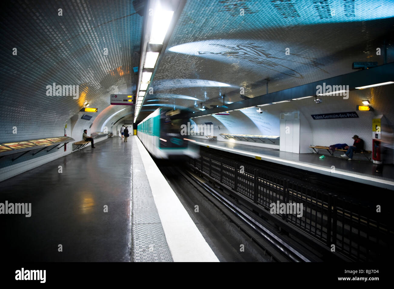 Subway platform with subway in motion Stock Photo