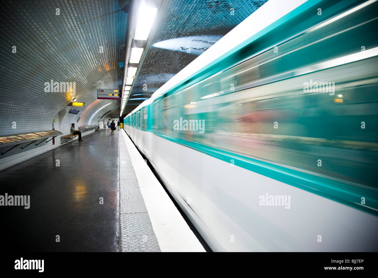 Subway platform with subway in motion Stock Photo