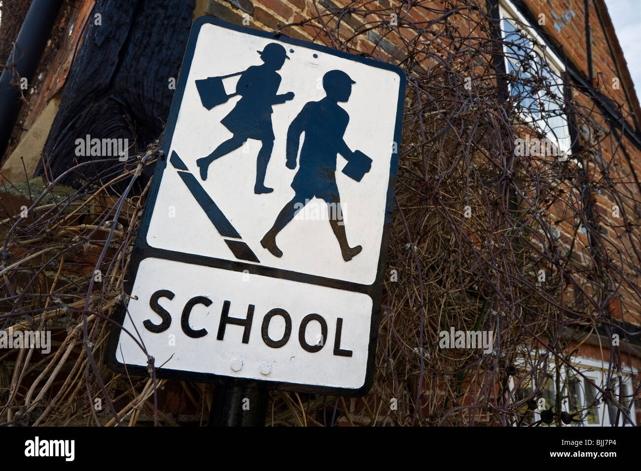 old fashioned traditional school warning street sign in Turville Buckinghamshire UK Stock Photo