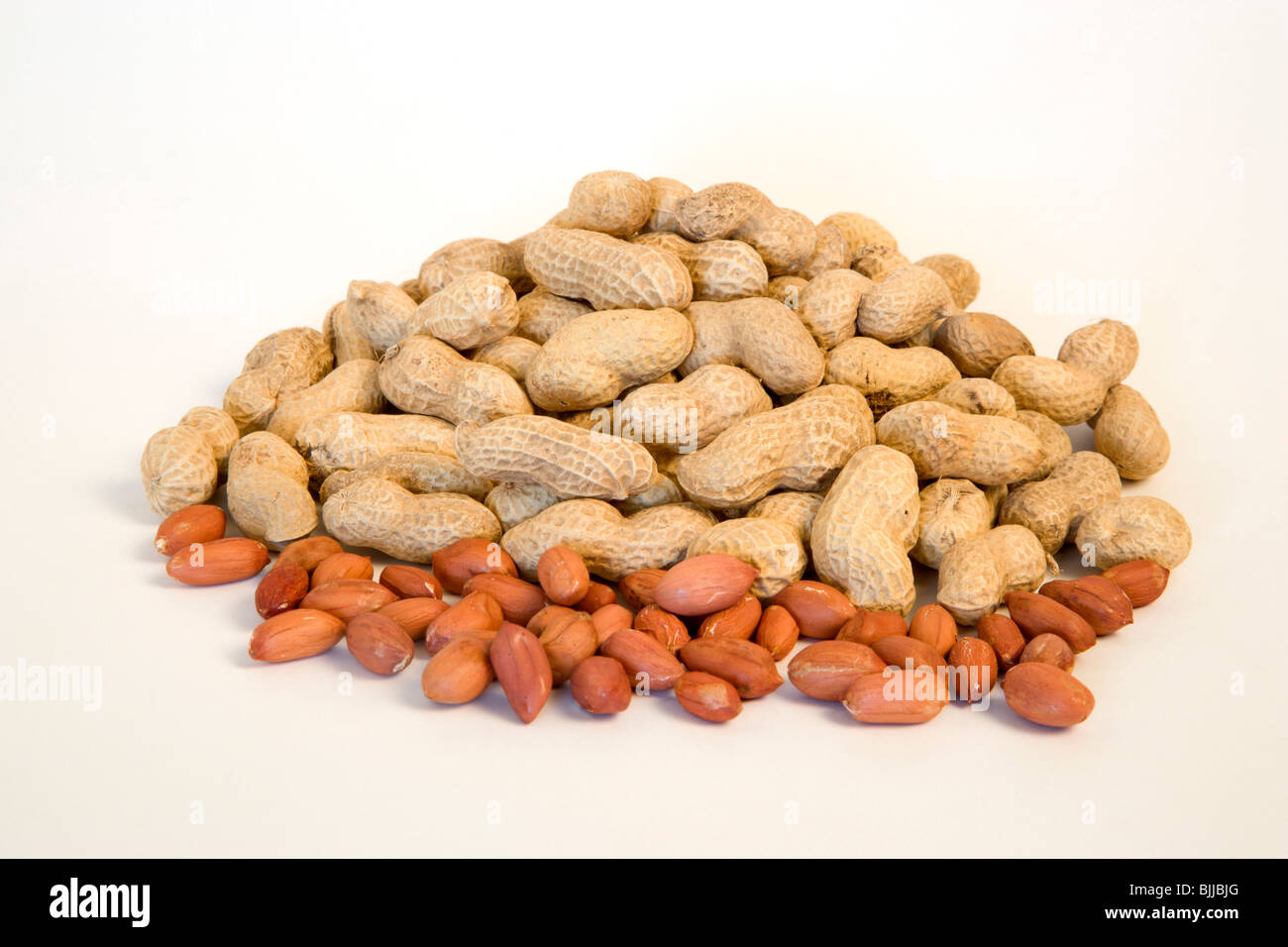 USA, Food, Nuts, Groundnuts Peanuts and kernels on a white background. Stock Photo
