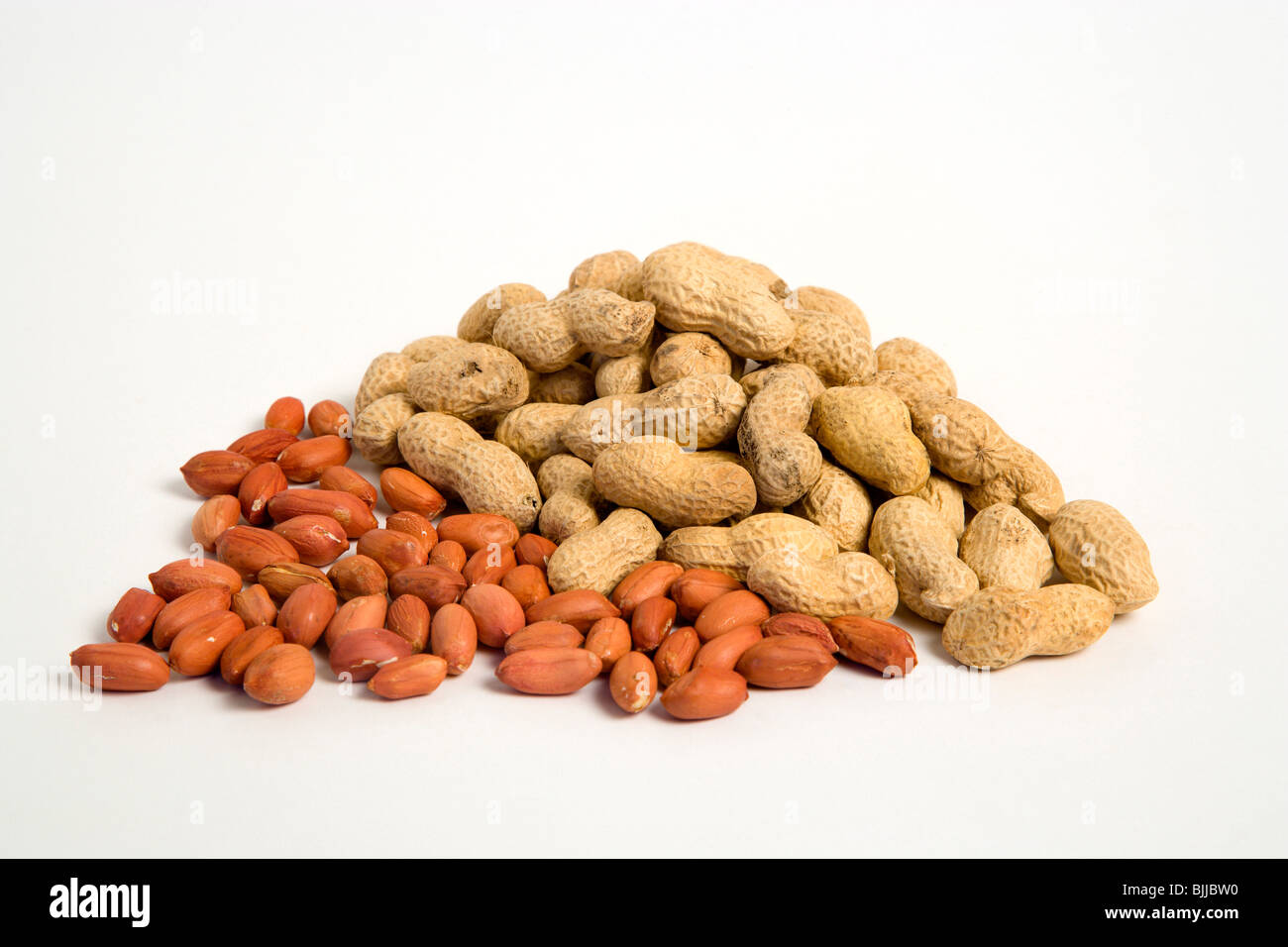 USA, Food, Nuts, Groundnuts Peanuts and kernels or shells on a white background. Stock Photo