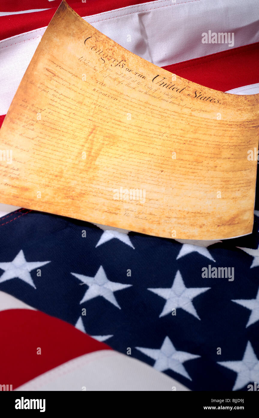 Vertical image of the the first page of the US Bill or Rights on the American flag Stock Photo