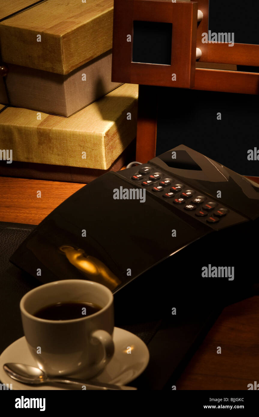 Coffee and intercom on desk Stock Photo