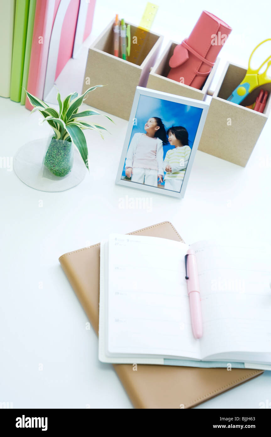 Notebooks on desk with pen Stock Photo Alamy