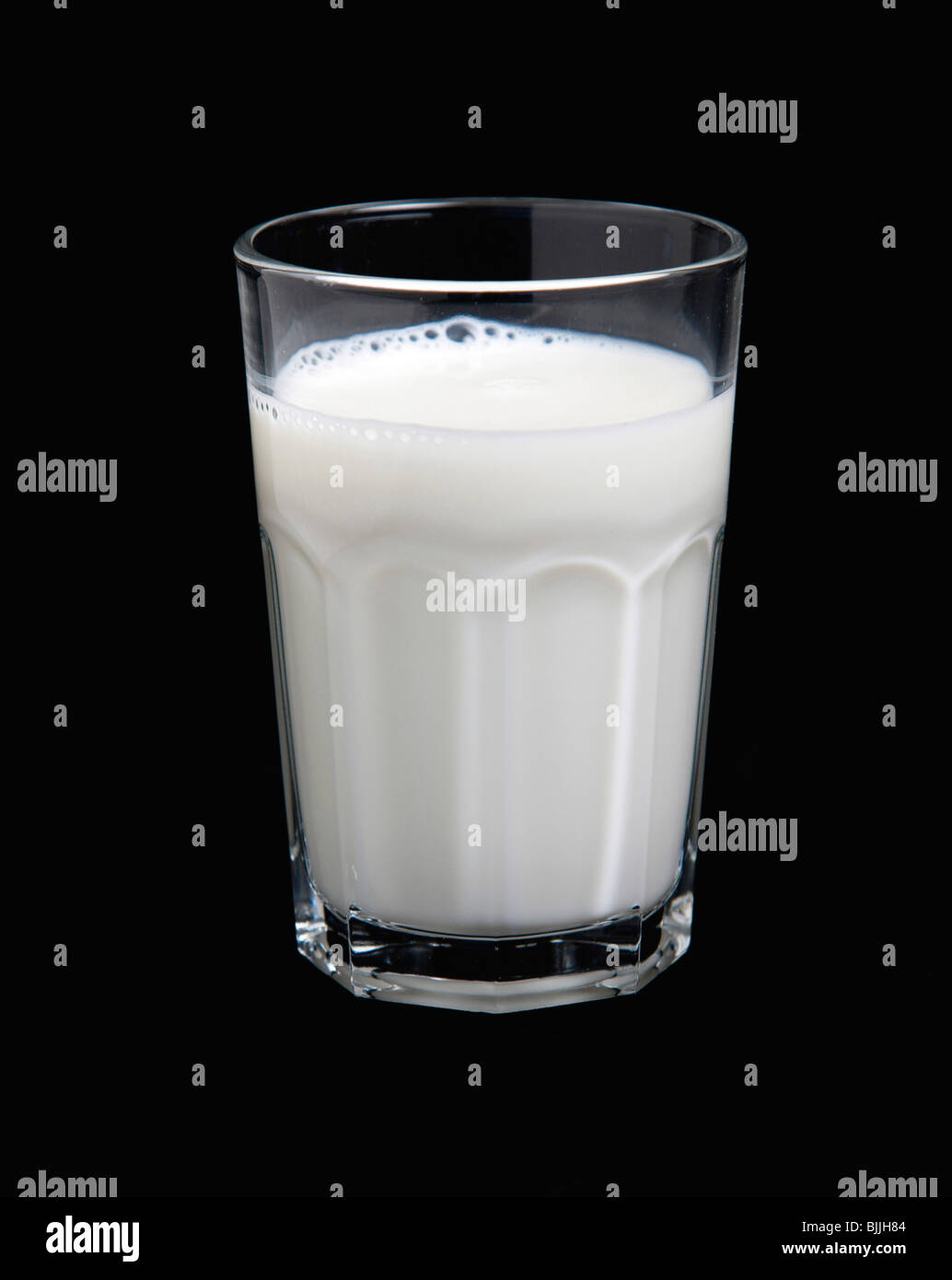 Drink, Milk, Tumbler glass of dairy milk against a black background Stock Photo