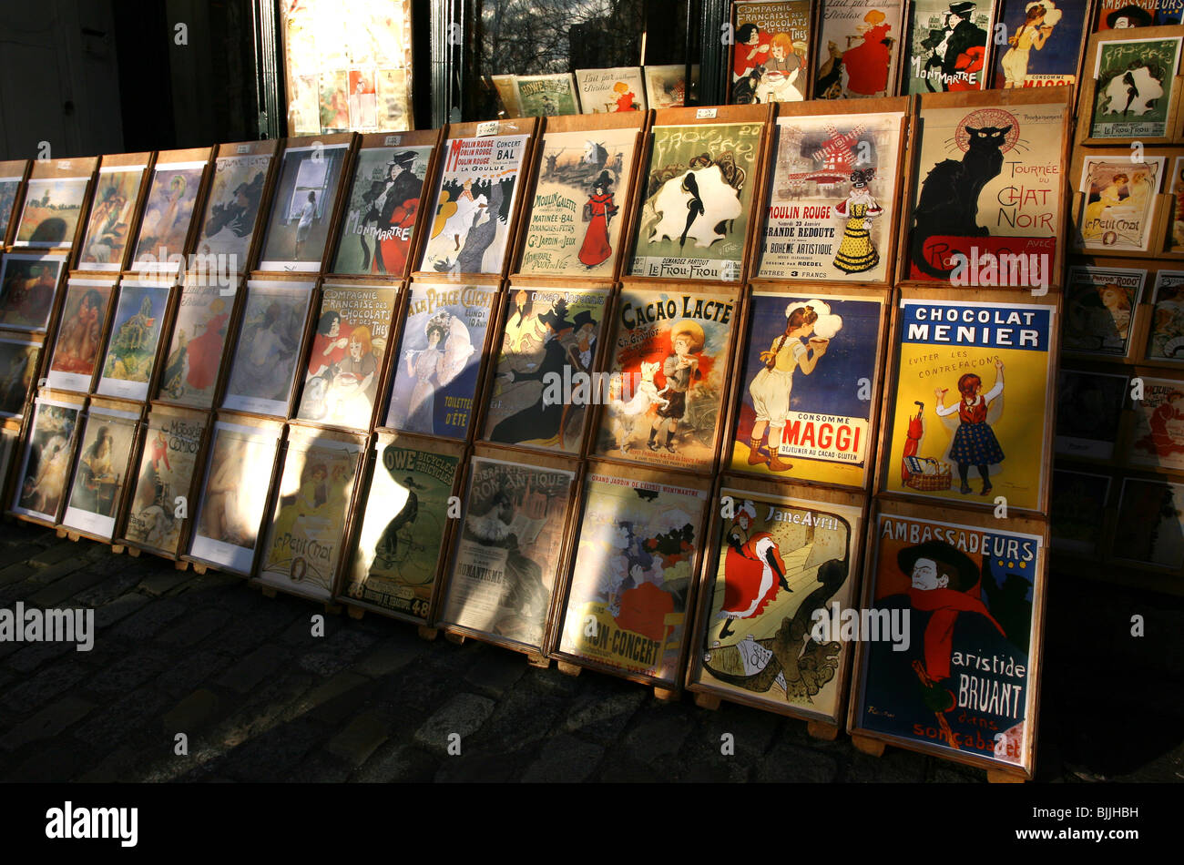 People's shadows are seen against vintage French posters in Monmatre, Paris Stock Photo