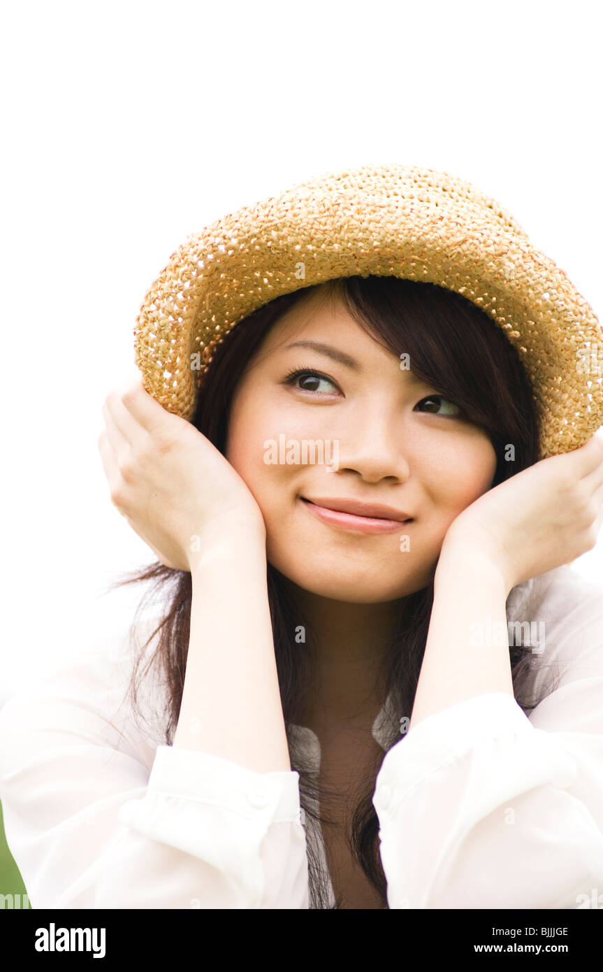 Portrait of woman wearing straw hat Stock Photo Alamy