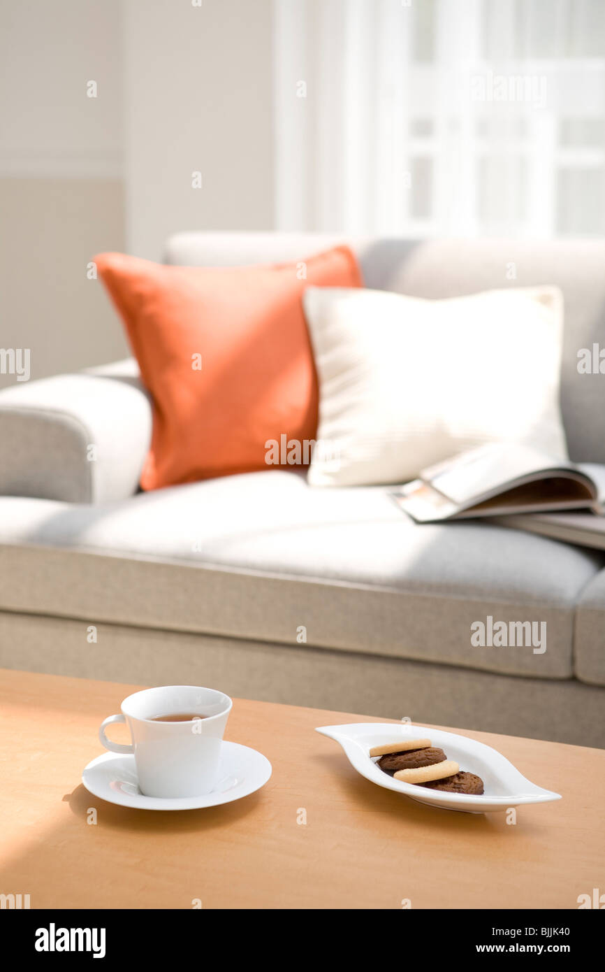 Afternoon Tea And Biscuits In Living Room Stock Photo