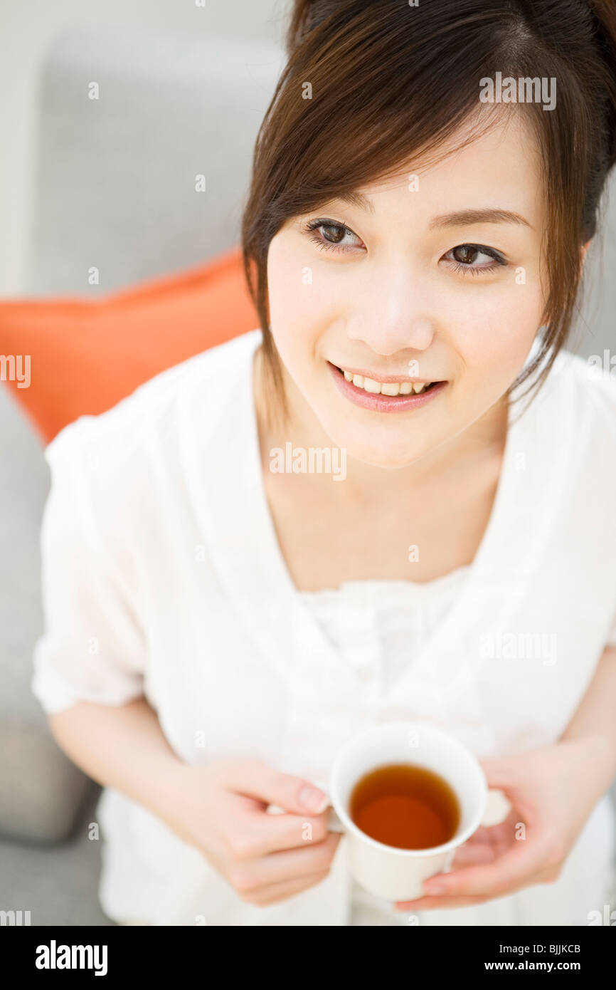 Woman drinking tea Stock Photo Alamy