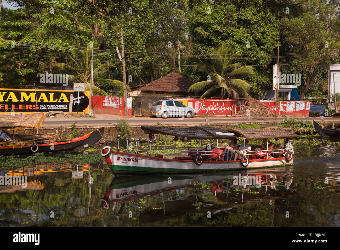 India, Kerala, Alappuzha, (Alleppey) North Canal, tourists on small backwater tourist excursion boat Stock Photo
