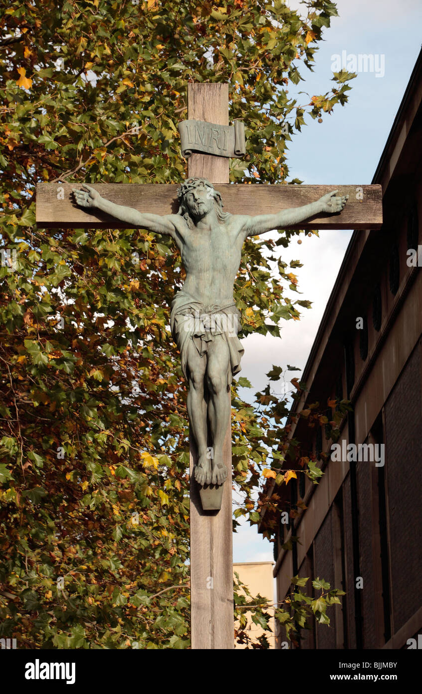 Jesus Christ on a cross (crucifix) outside St John The Evangelist parish church in Waterloo, London. Stock Photo
