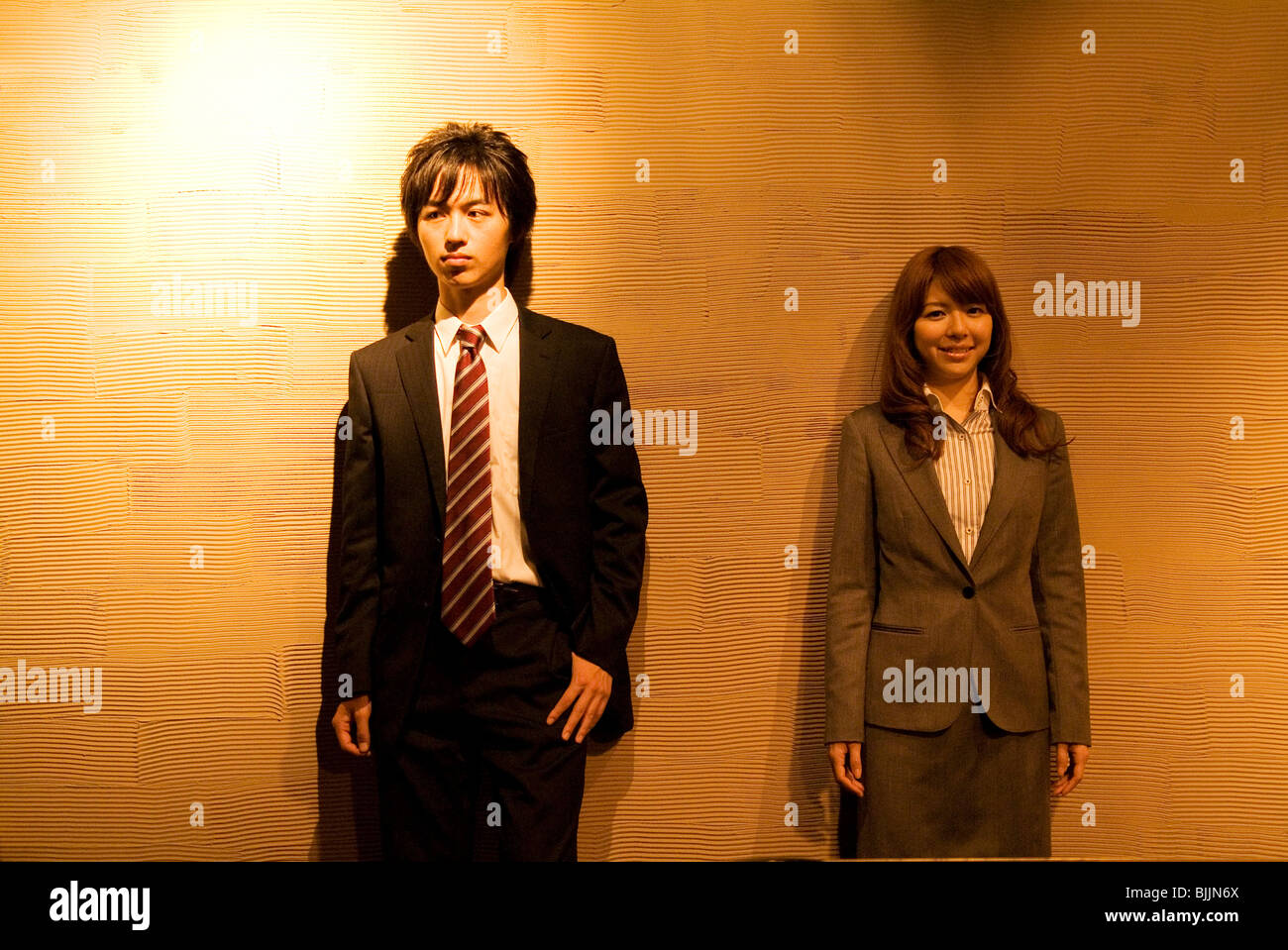 Two businesspeople standing side by side Stock Photo - Alamy