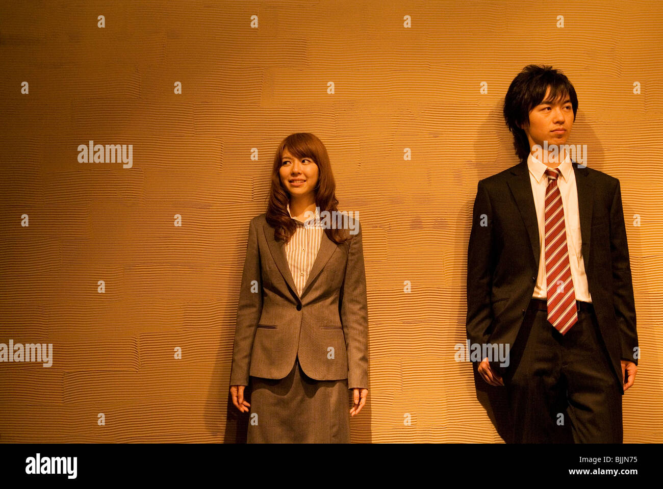 Two businesspeople standing side by side Stock Photo - Alamy