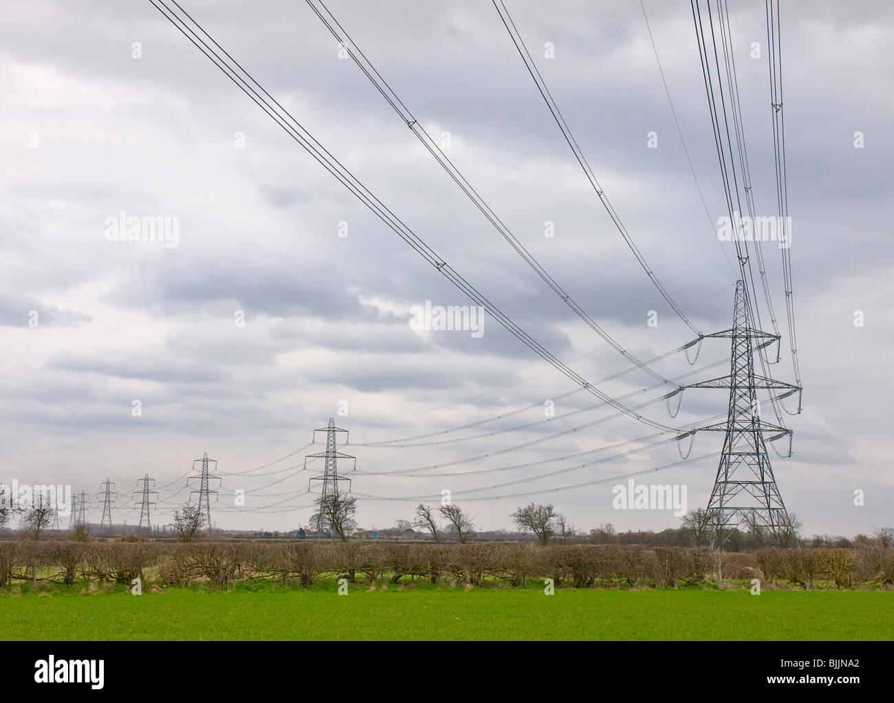 Electricity pylons taking overhead cables  from the West Burton Coal Fired Power Station in Nottinghamshire. Stock Photo