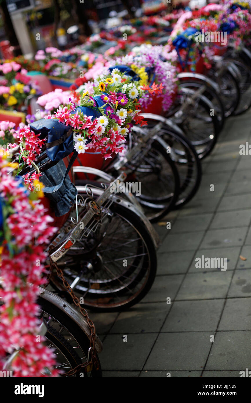 Bicycles decorated with flowers in Bangkok, Thailand Stock Photo