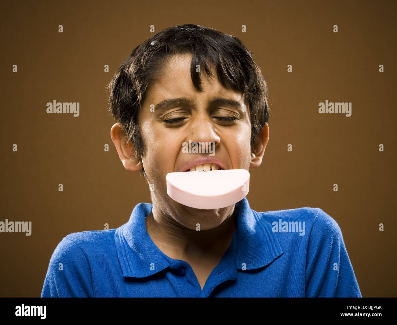 Boy with bar of soap in mouth Stock Photo Alamy