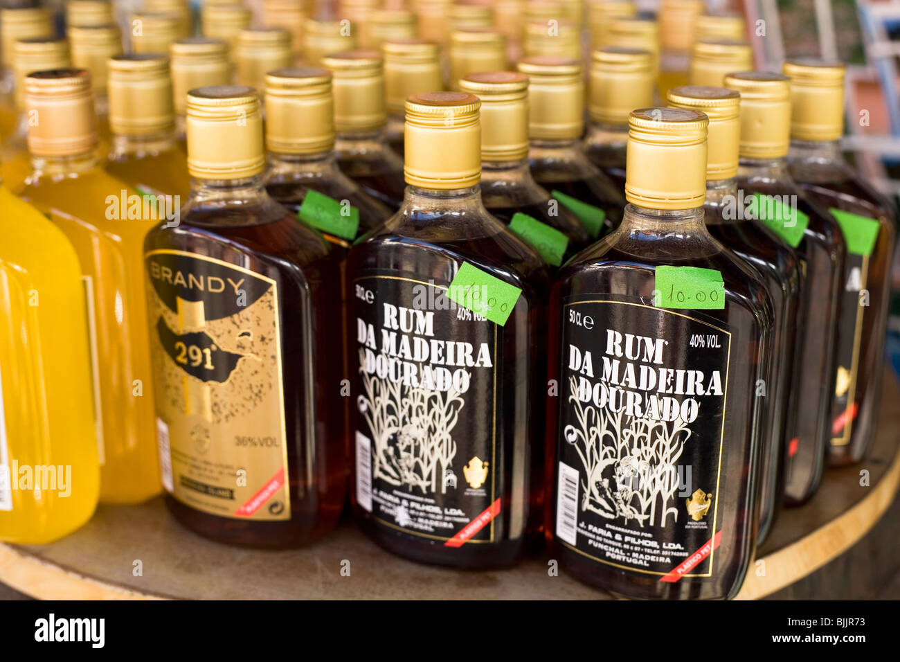 Bottles of rum and brandy are offered for sale at shop in Funchal on