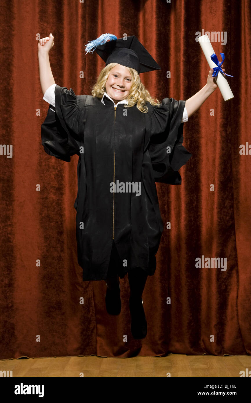 Girl graduate with mortar board and diploma smiling and cheering Stock ...