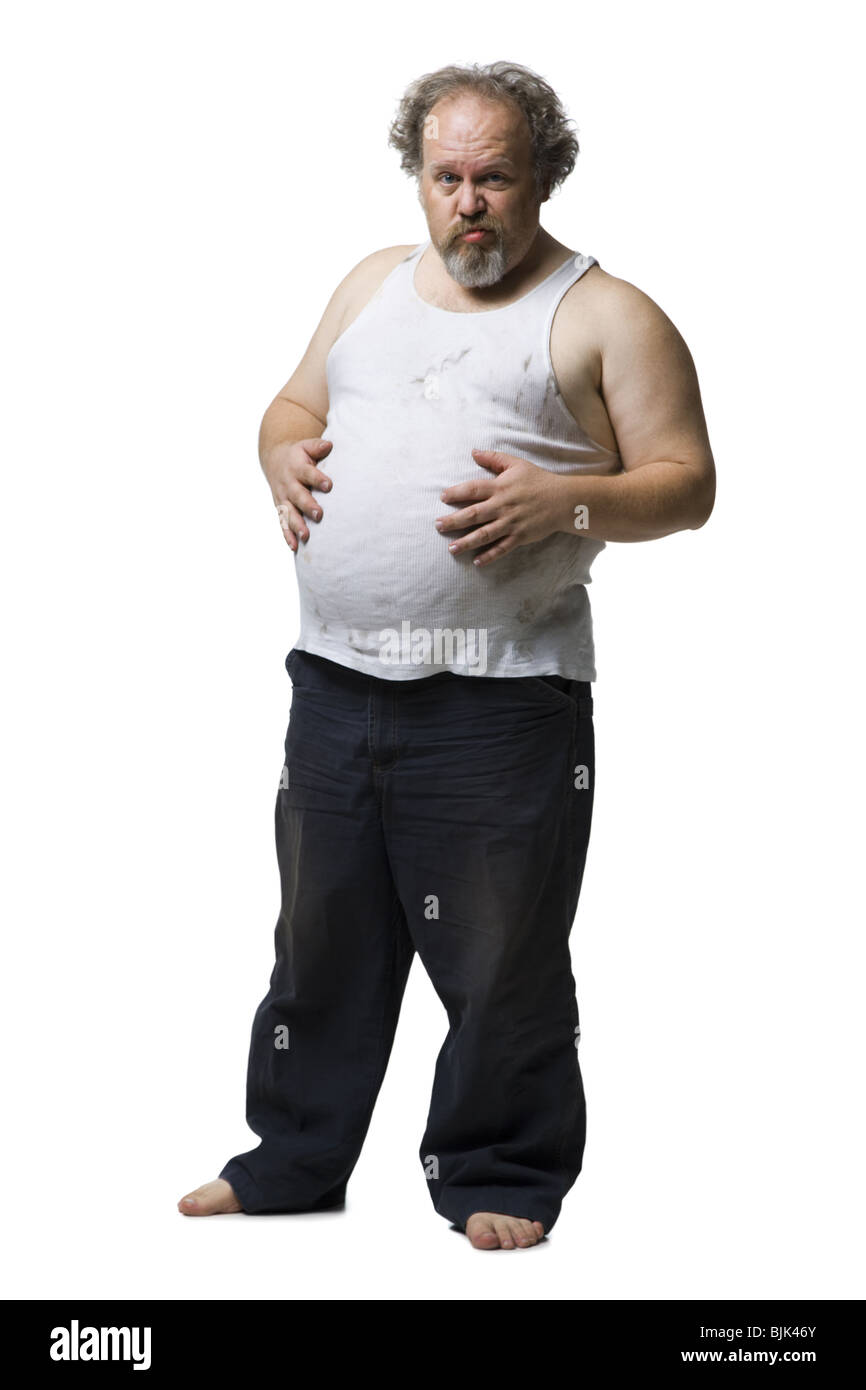 Disheveled man with hands on pot belly Stock Photo