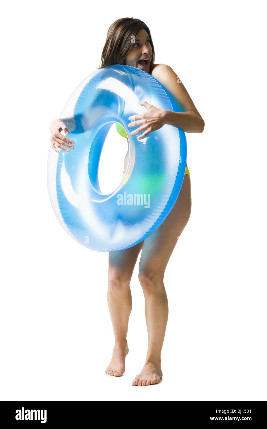 Woman in bikini hugging swimming ring Stock Photo - Alamy