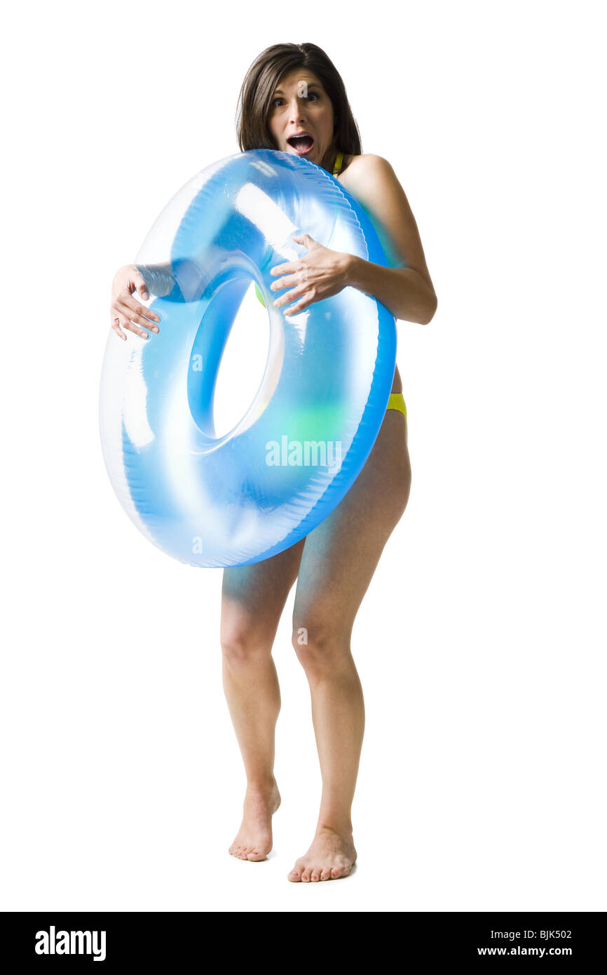 Woman in bikini hugging swimming ring Stock Photo