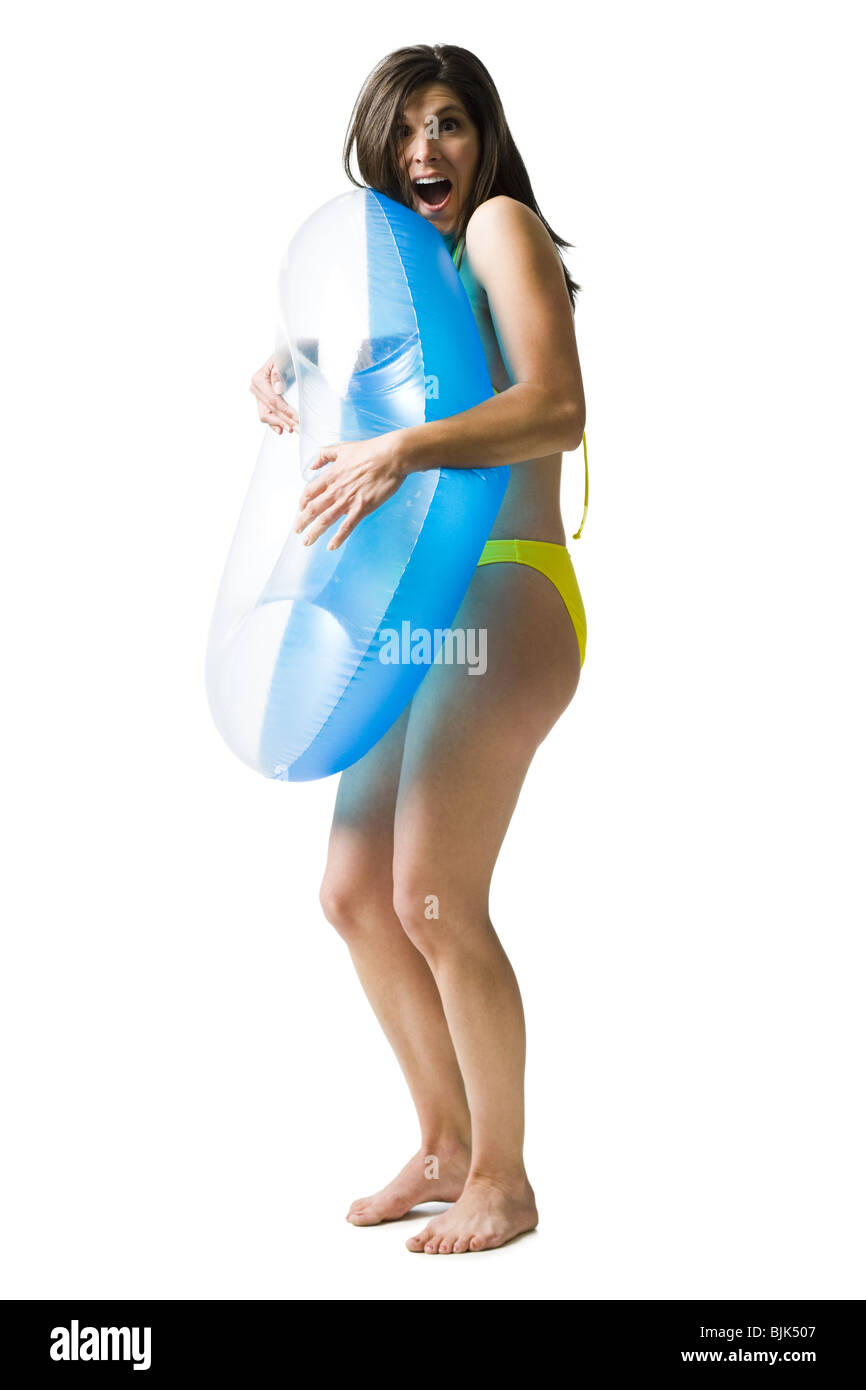 Woman in bikini hugging swimming ring Stock Photo