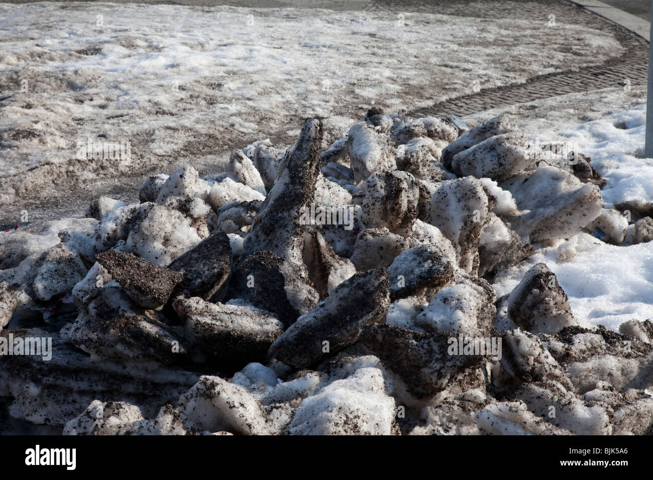 Old dirty snow in the streets of a city, German saying, Schnee von gestern, meaning yesterday's news Stock Photo