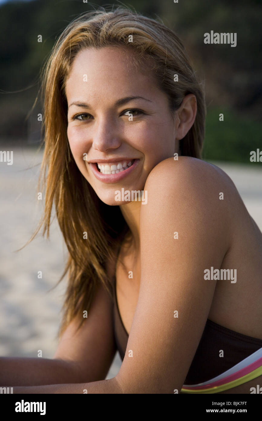 Woman in bikini on beach smiling Stock Photo - Alamy