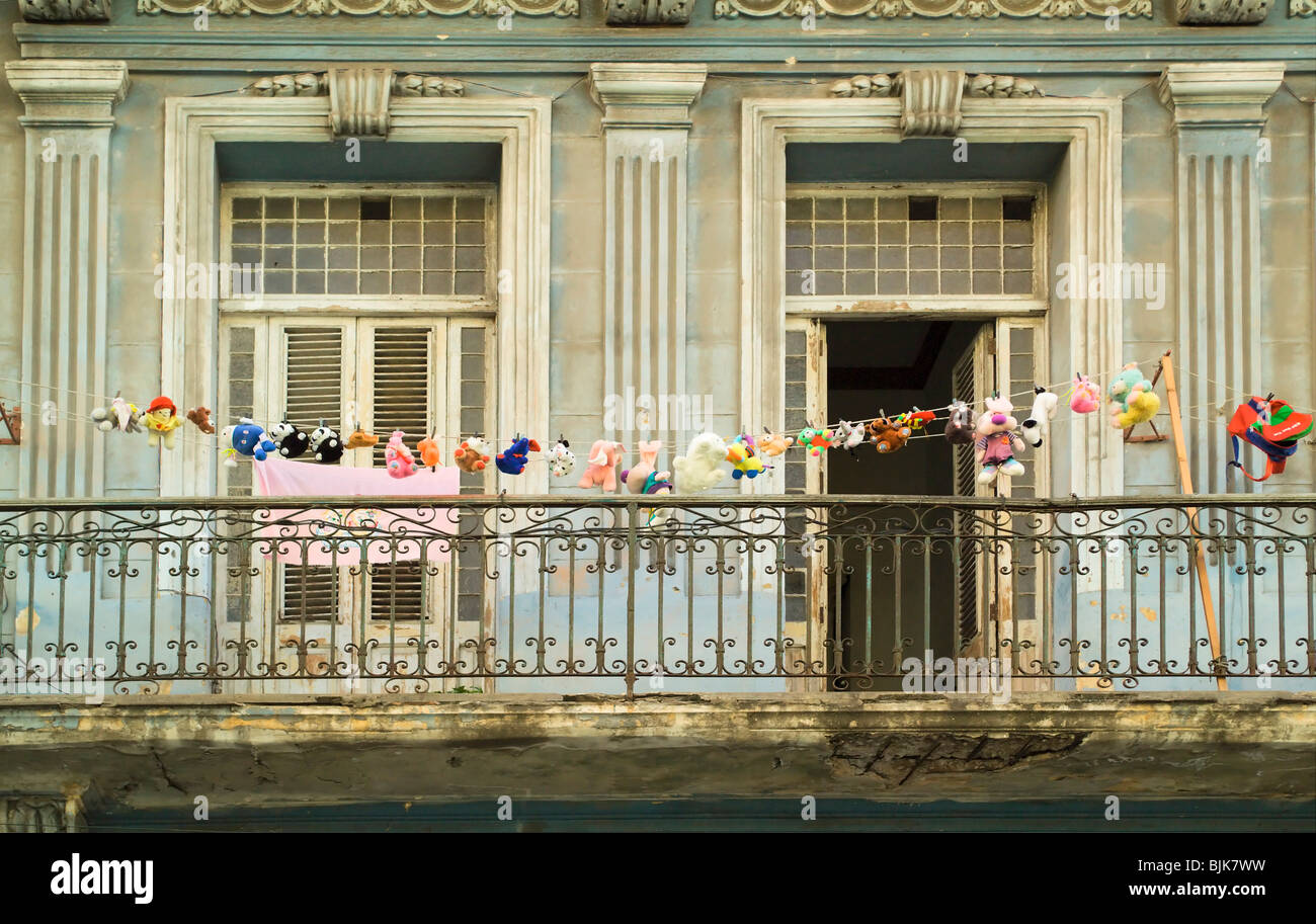 Clothesline with 26 stuffed animals in Centro Habana, Havana, Cuba, Caribbean Stock Photo