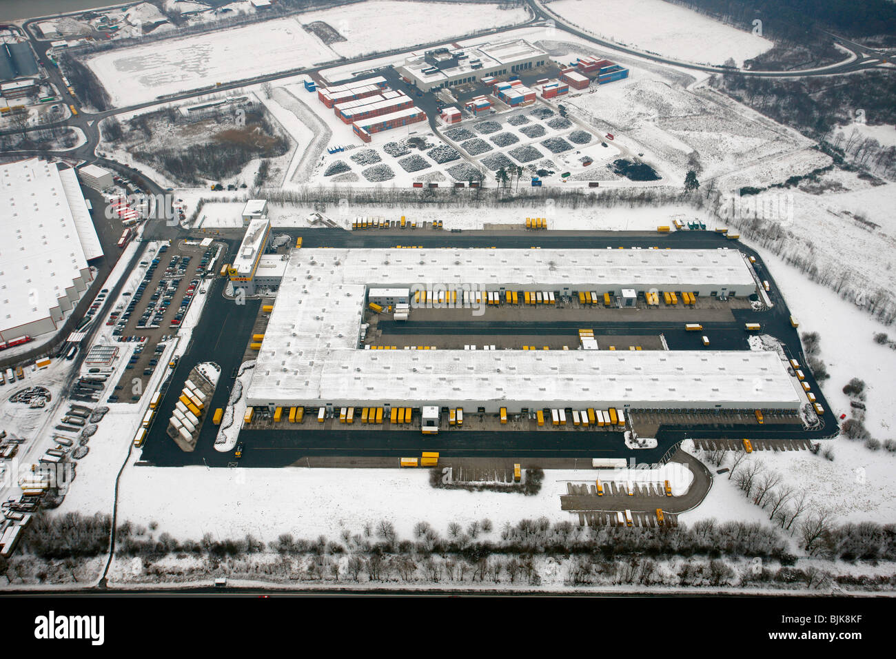 Aerial view, snow, DHL vehicle fleet, Hervest, Dorsten, Ruhrgebiet area, North Rhine-Westphalia, Germany, Europe Stock Photo