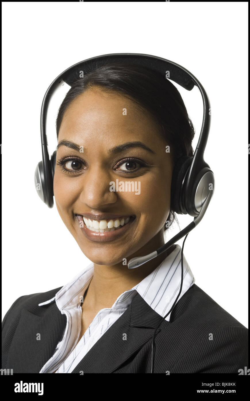 Portrait of woman with headset smiling Stock Photo - Alamy