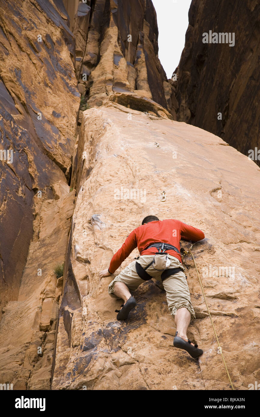 Man climbing mountain Stock Photo Alamy