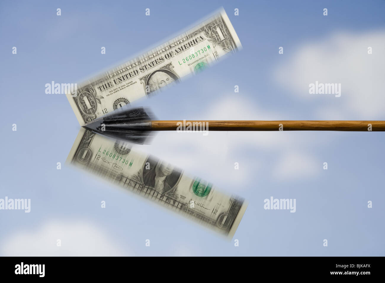 Arrow slicing American one dollar bill Stock Photo
