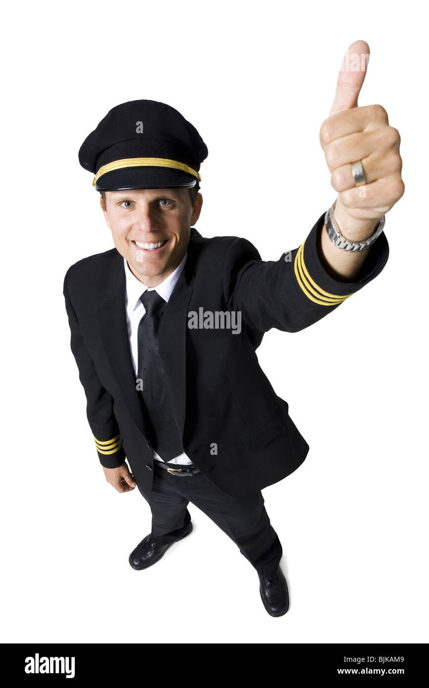 Pilot standing with arms crossed smiling Stock Photo Alamy