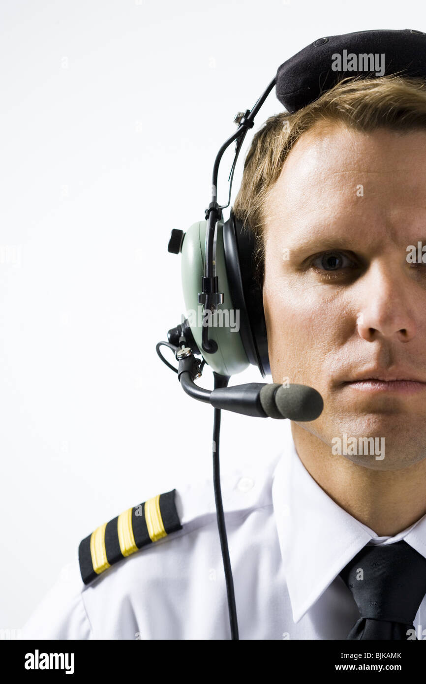 Pilot with headset and microphone Stock Photo Alamy