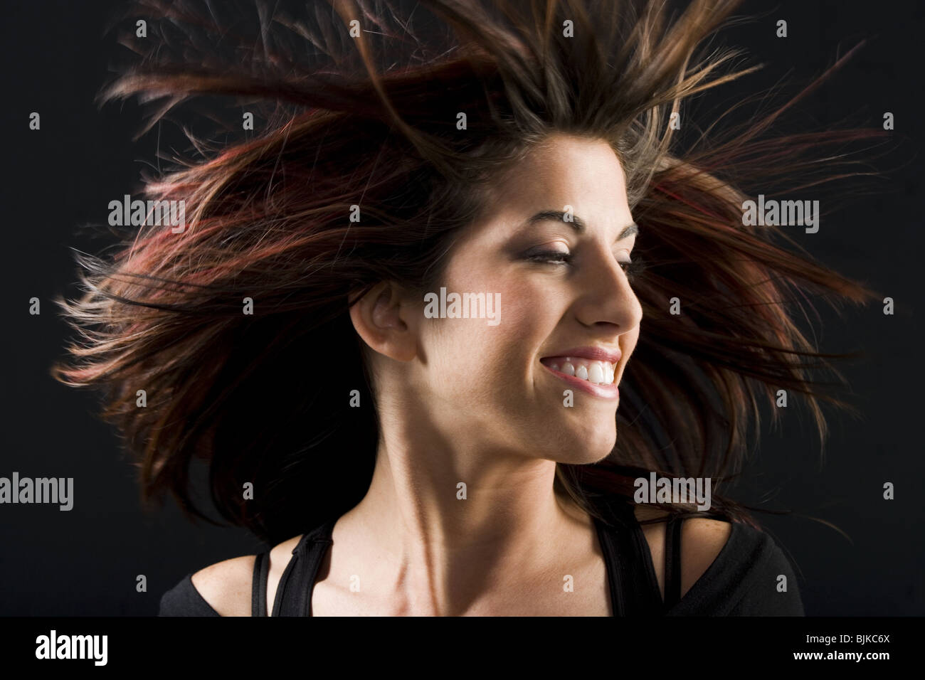 Woman in black dancing Stock Photo