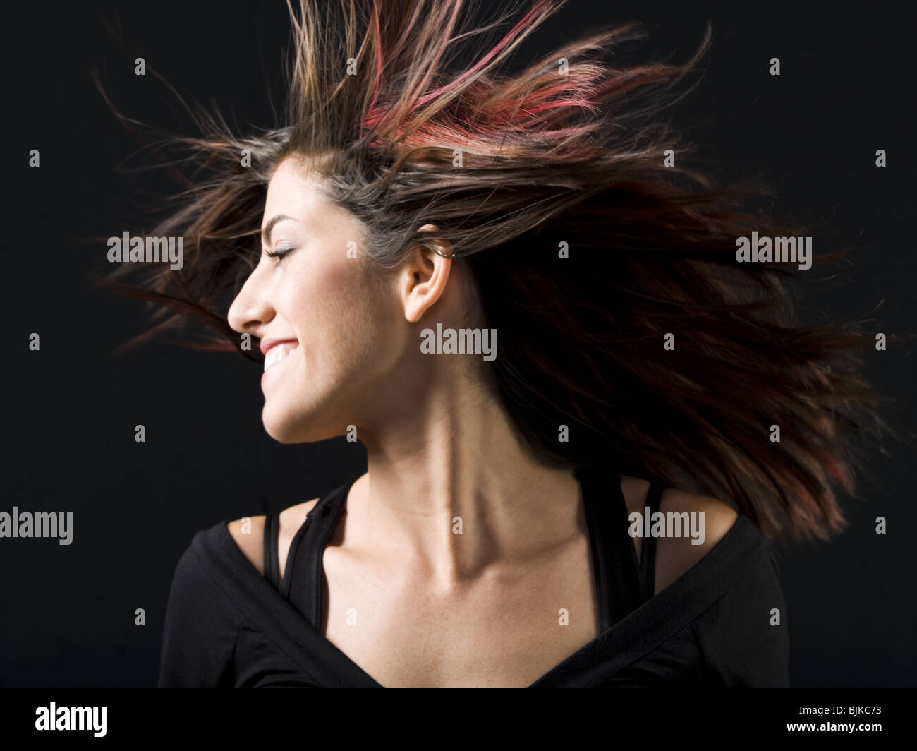 Woman in black dancing Stock Photo