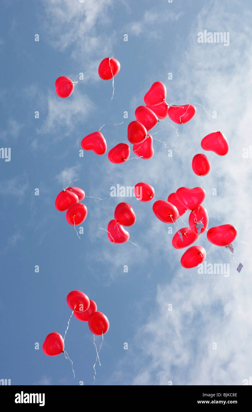 Heart-shaped balloons in the blue sky at a wedding celebration Stock ...