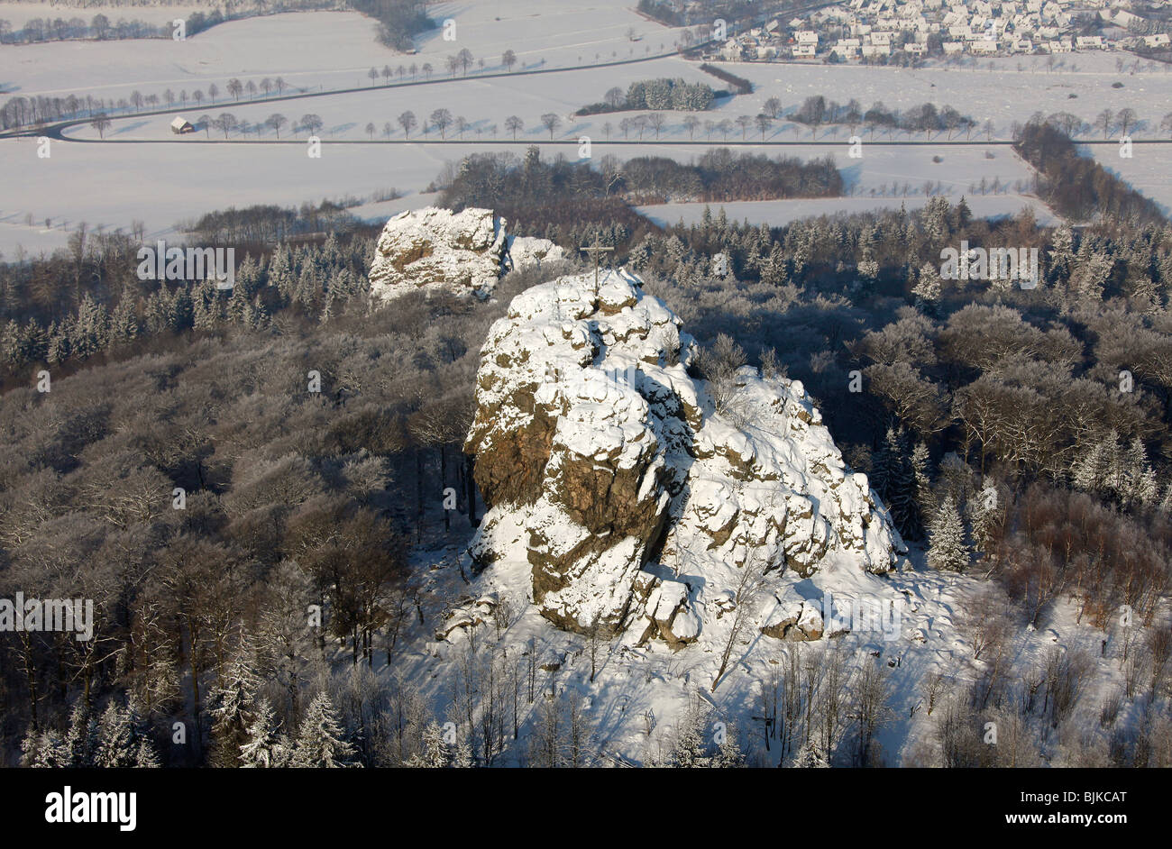 Aerial photo, Bruchhauser Steine, four large porphyry rocks located on a mountain, snow, winter, Olsberg, Sauerland, North Rhin Stock Photo