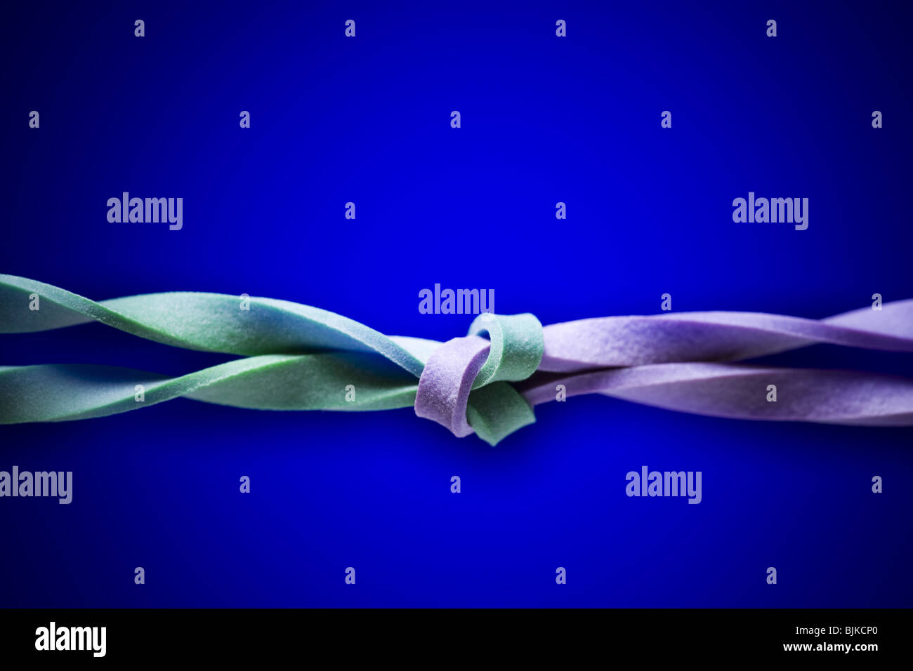 Two elastic bands intertwined Stock Photo Alamy